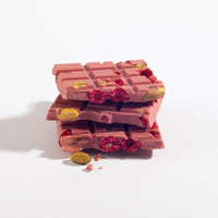 Charles Chocolates Ruby Garnet Raspberry & Pistachio Bar, broken pieces stacked