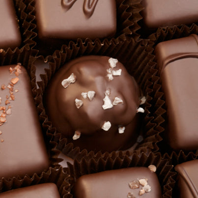 A close up of a chocolate cluster with salt.