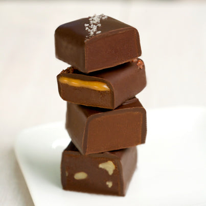 Four different chocolates sliced and stacked vertically