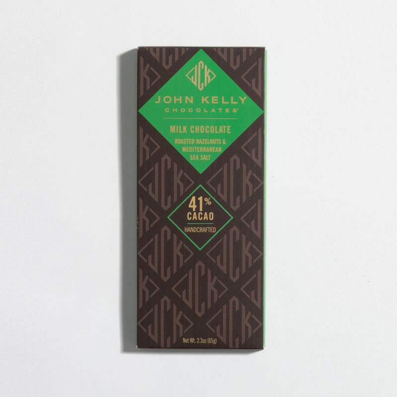 John Kelly Chocolates Milk Chocolate Bar with Roasted Hazelnuts & Mediterranean Salt, in its wrapper