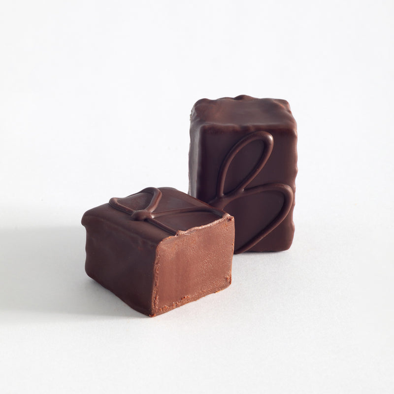 John Kelly Chocolates 6 Piece Dark Chocolate with Bourbon, cut to show the center