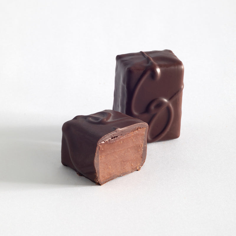 John Kelly Chocolates 2 Piece Semi-Sweet Chocolate with Coconut, cut to show the center