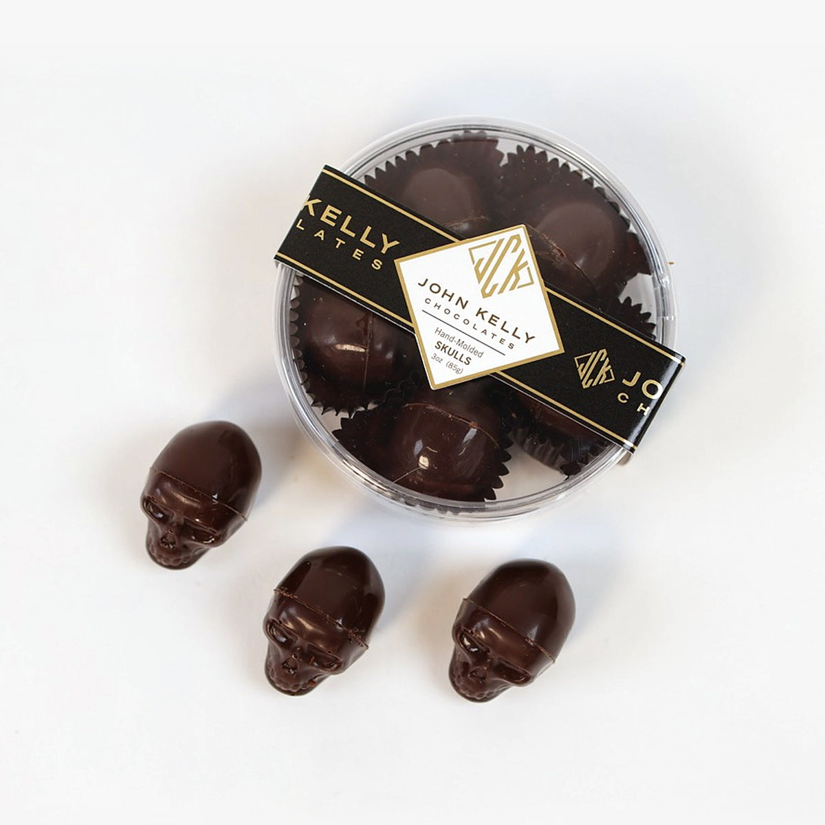 Dark chocolate skulls, boxed with three loose skulls in front