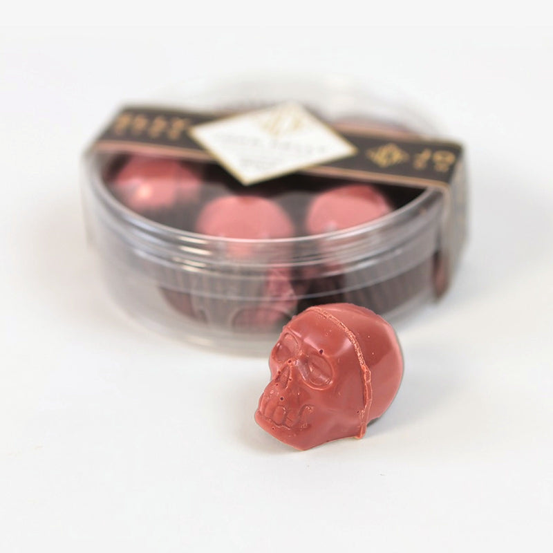 5-Piece Garnet Skulls with Candied Apple Caramel Filling, closed box with one skull in front