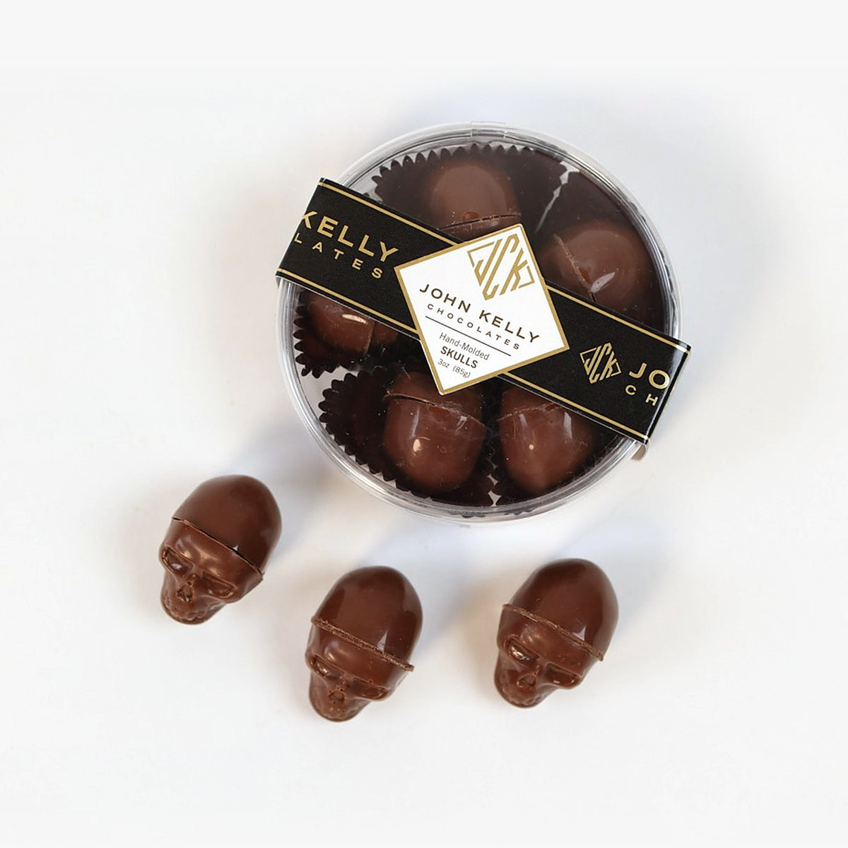 Milk chocolate skulls, boxed with three loose skulls in front