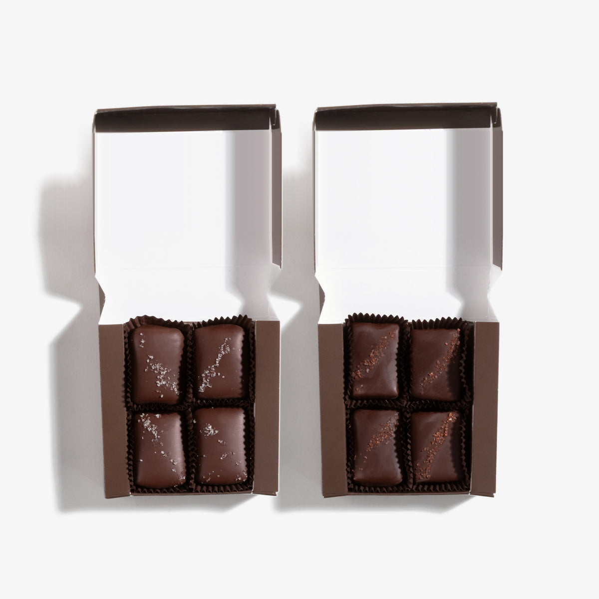 Truffle Fudge Bites Combo Gift Tower, both boxes opened: 4pc Dark Chocolate with French Grey Sea Salt, 4pc Chocolate & Caramel with Red Hawaiian Alaea Sea Salt