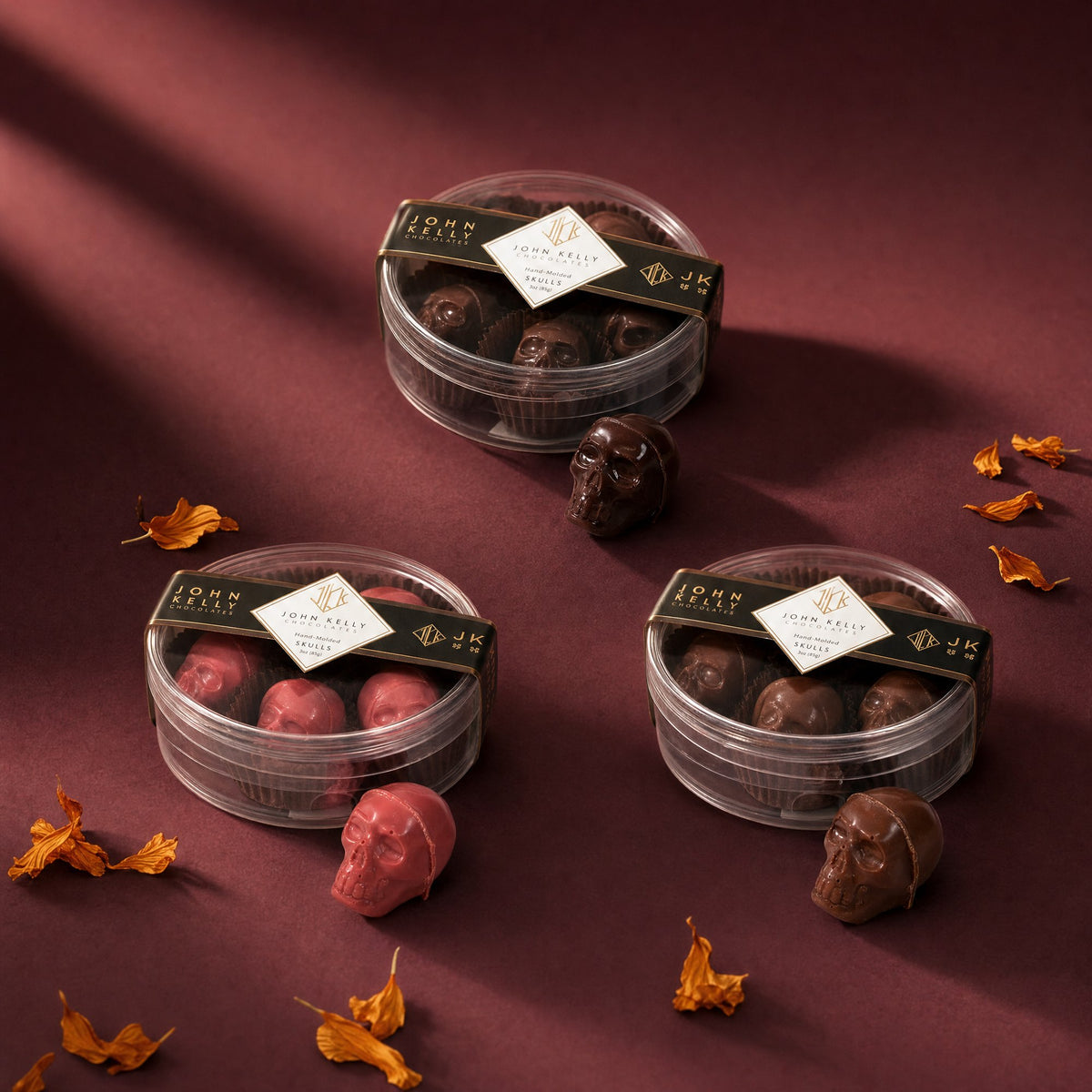Hand-molded Halloween chocolate skulls in garnet, dark and milk chocolate