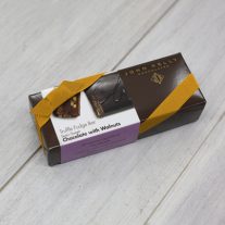 A semi-sweet chocolate with walnuts 8oz bar box with a gold ribbon