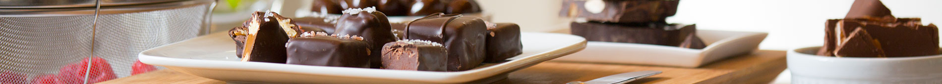 A photo of a plate of John Kelly Chocolates on a countertop.