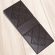 A dark chocolate bar. The bar has John Kelly Chocolates logo on it.