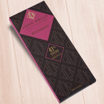A dark brown, rectangular box. There is a pink diamond on it that holds a John Kelly Chocolates logo and the product name.
