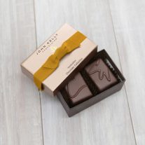 An open 2 piece assortment with a gold ribbon